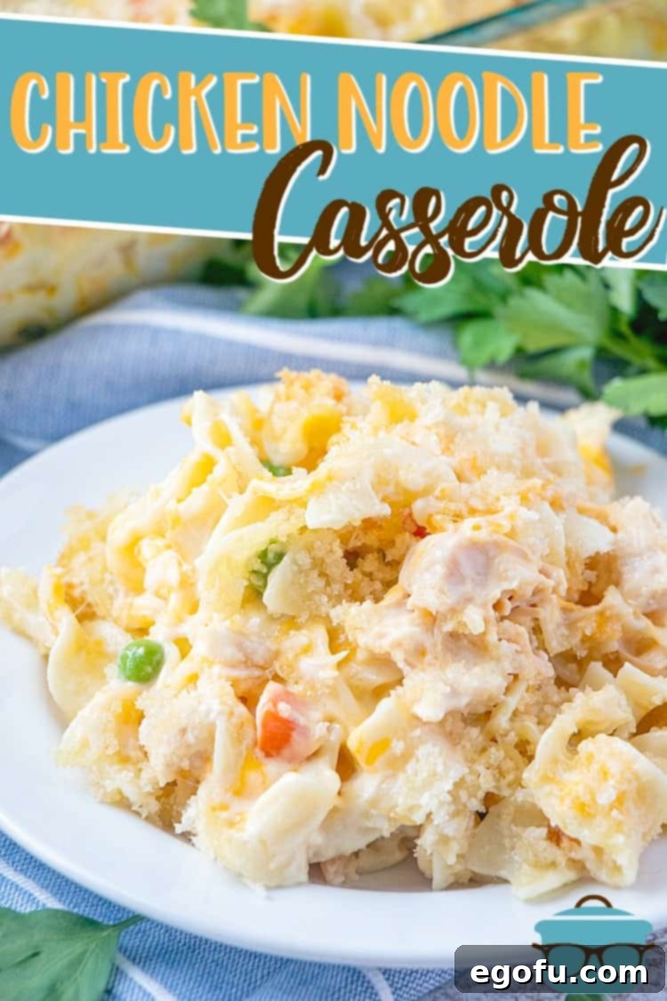 A generous serving of Easy Chicken Noodle Casserole on a small white plate, ready to be enjoyed.