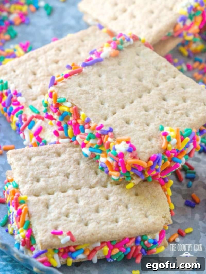 A pile of Graham Cracker Goodies with colorful sprinkles, served cold on a plate, showcasing their inviting appearance.
