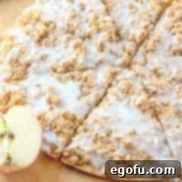 Thumbnail image of sliced Apple Dessert Pizza, showing its inviting texture and golden-brown crumble.