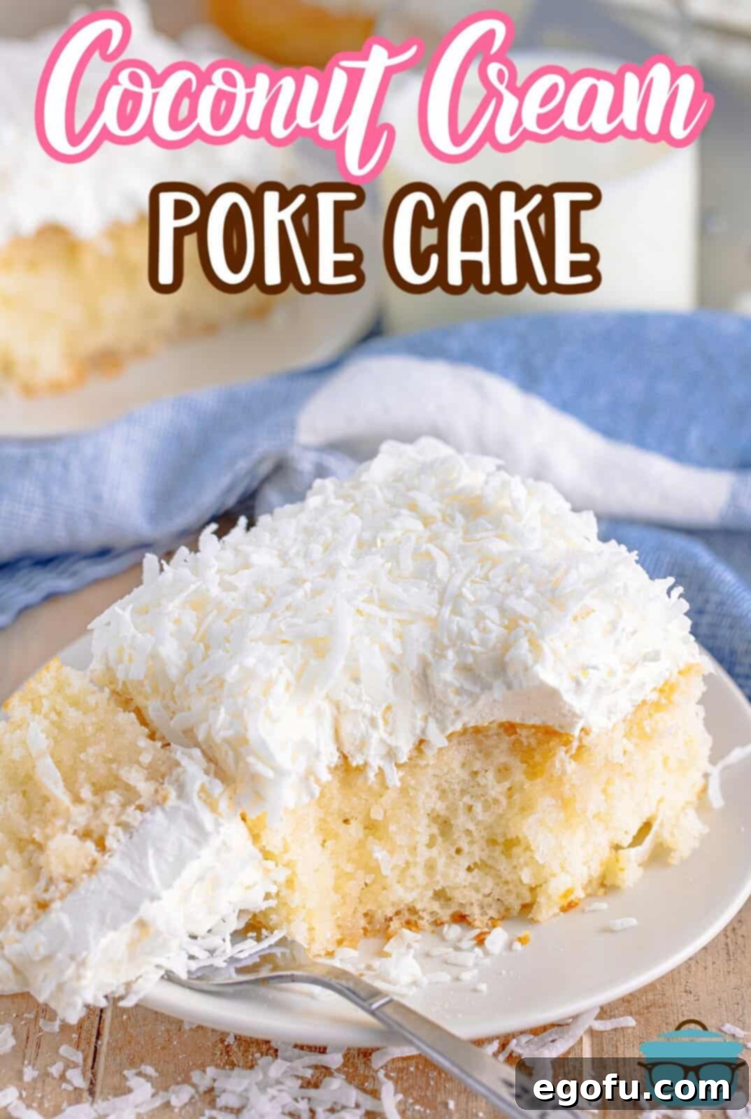 a slice of coconut poke cake on a small white plate that has a bite removed on a fork that is set to the side.