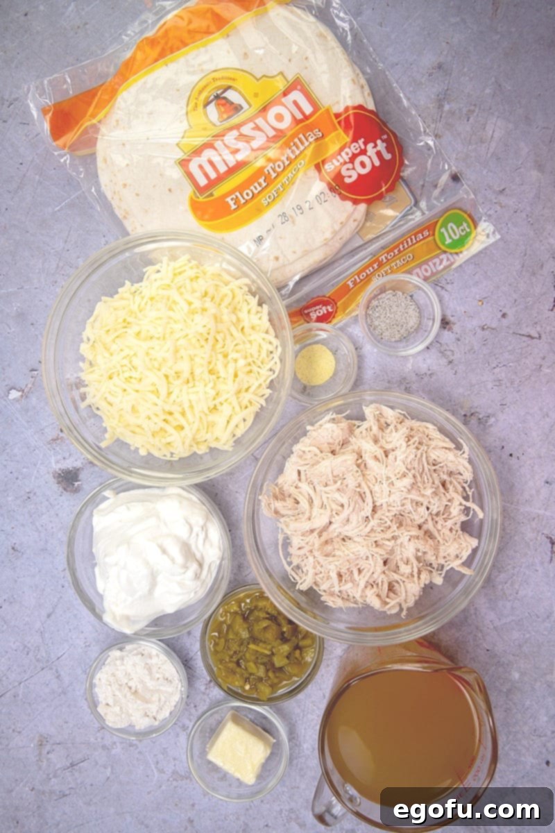 Decadent White Chicken Enchiladas 4 Flour tortillas, shredded cooked chicken, Monterey Jack cheese, butter, flour, chicken broth, sour cream, diced green chiles salt, pepper, Adobo seasoning