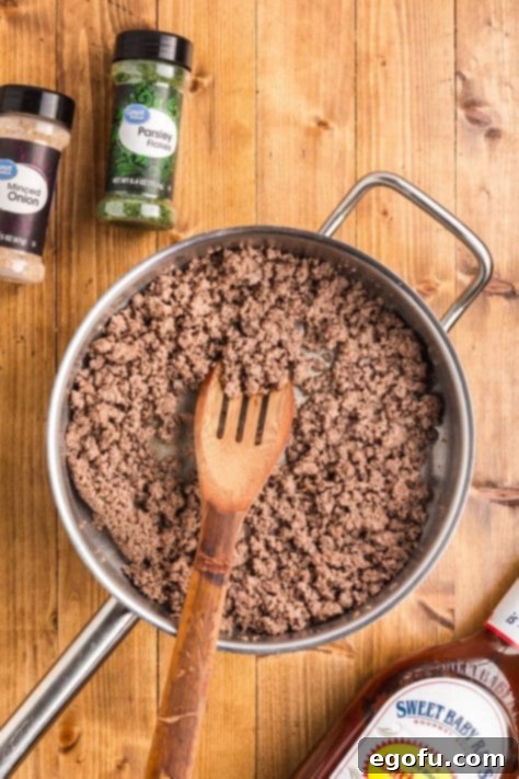 Smoky Beef Biscuit Pockets 11 Browned and crumbled ground beef in a skillet.