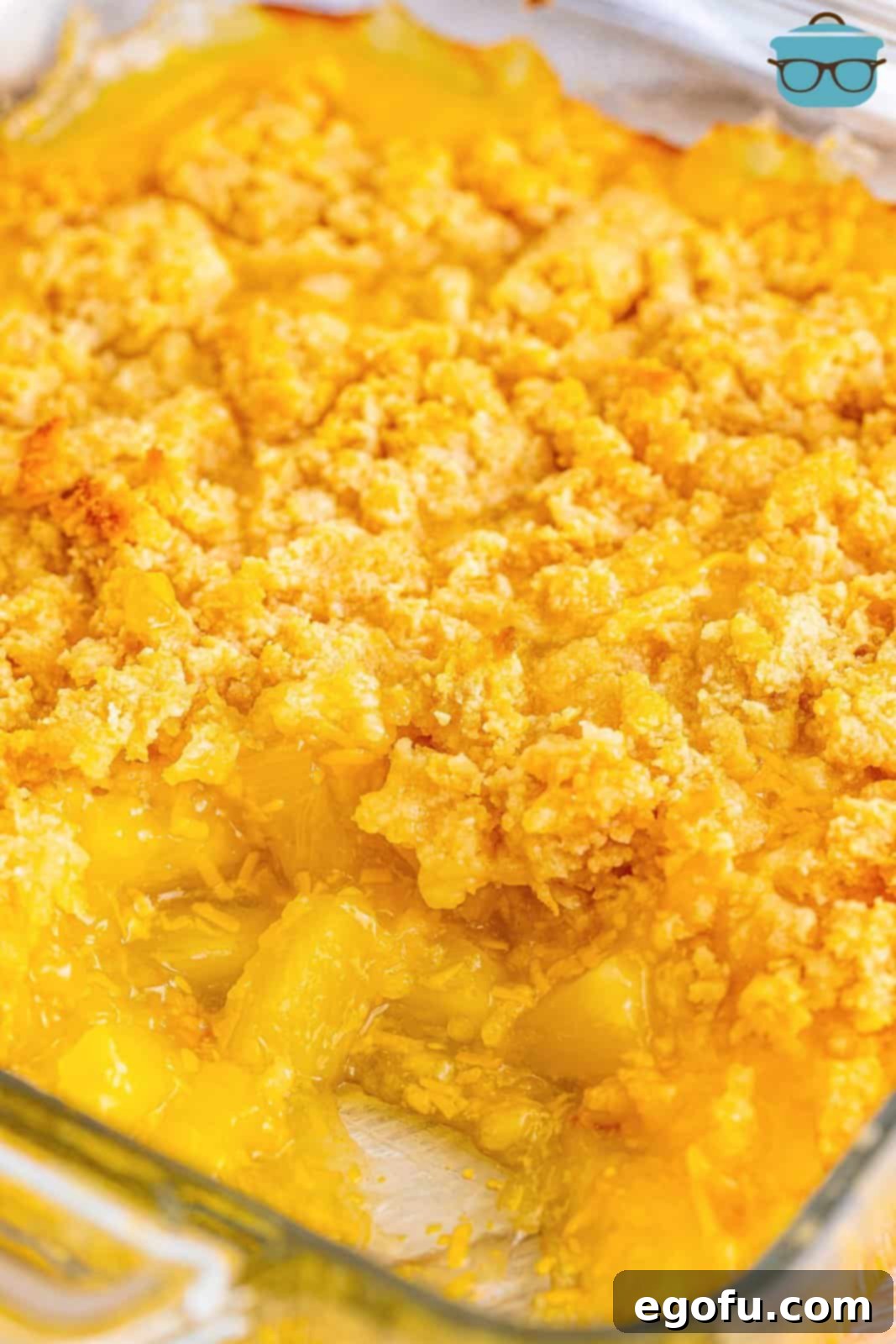 A beautifully baked dish of Southern Pineapple Casserole, showcasing its golden-brown topping and warm, inviting interior.