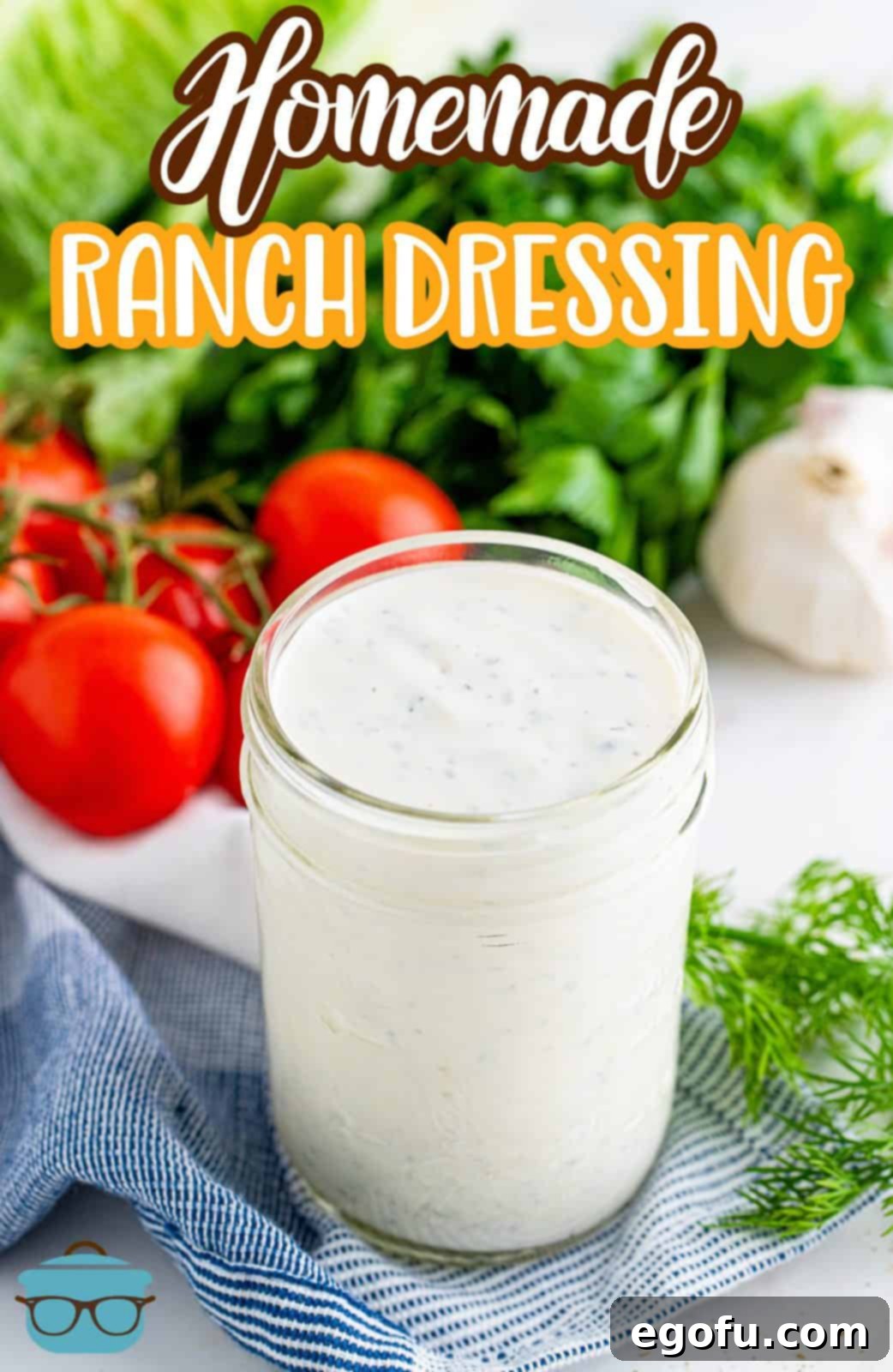 Handcrafted Ranch Bliss 4 homemade ranch dressing shown in a small mason jar with fresh tomatoes and lettuce in the background.