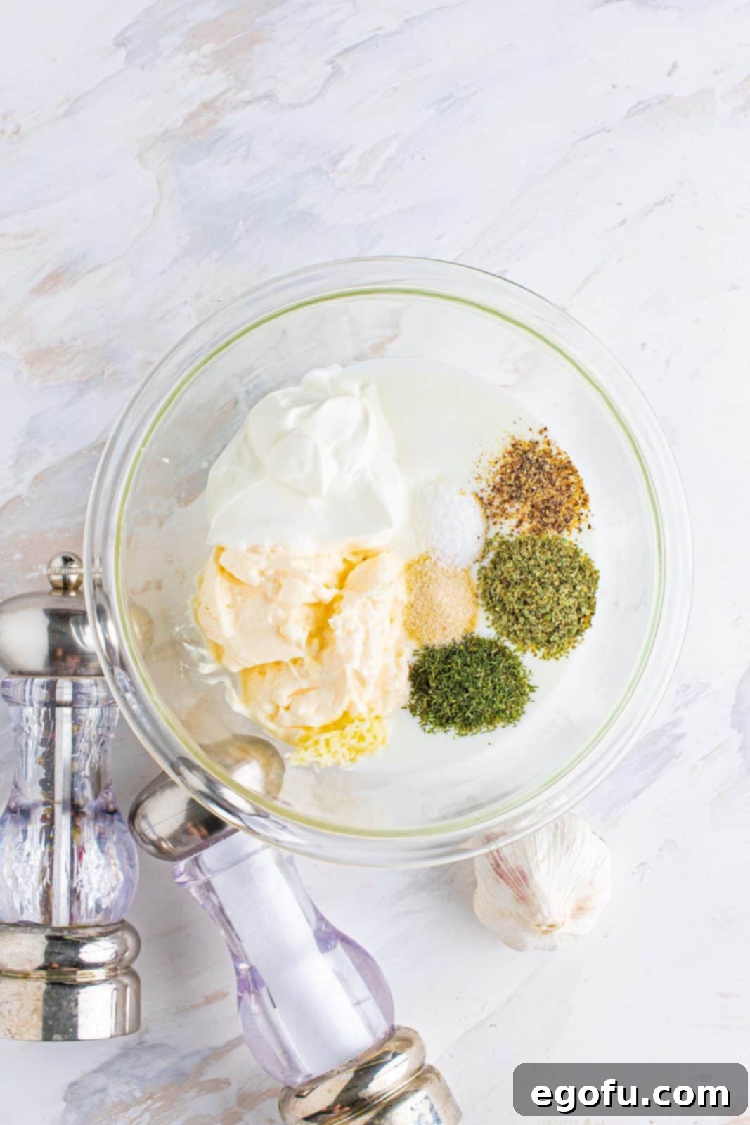 Handcrafted Ranch Bliss 6 ranch dressing ingredients in a clear bowl.