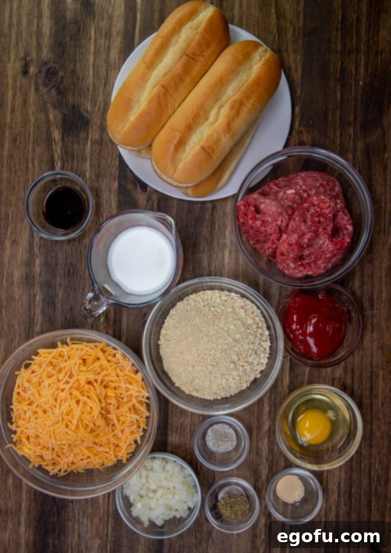 6-inch sub rolls, lean ground beef, crushed saltine crackers, egg, diced onion, milk, ketchup, Worcestershire sauce, dried thyme, garlic powder, shredded cheddar cheese, salt and pepper.