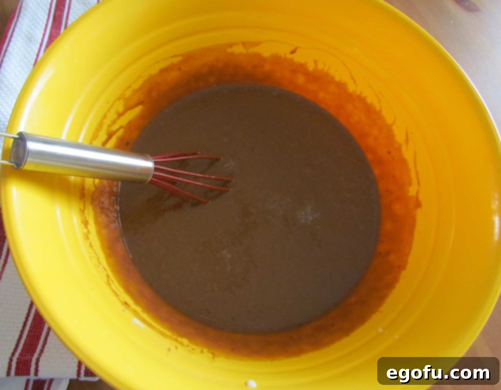C Is For Cookie Layers 11 instant pudding mixed together with a whisk in a bowl.