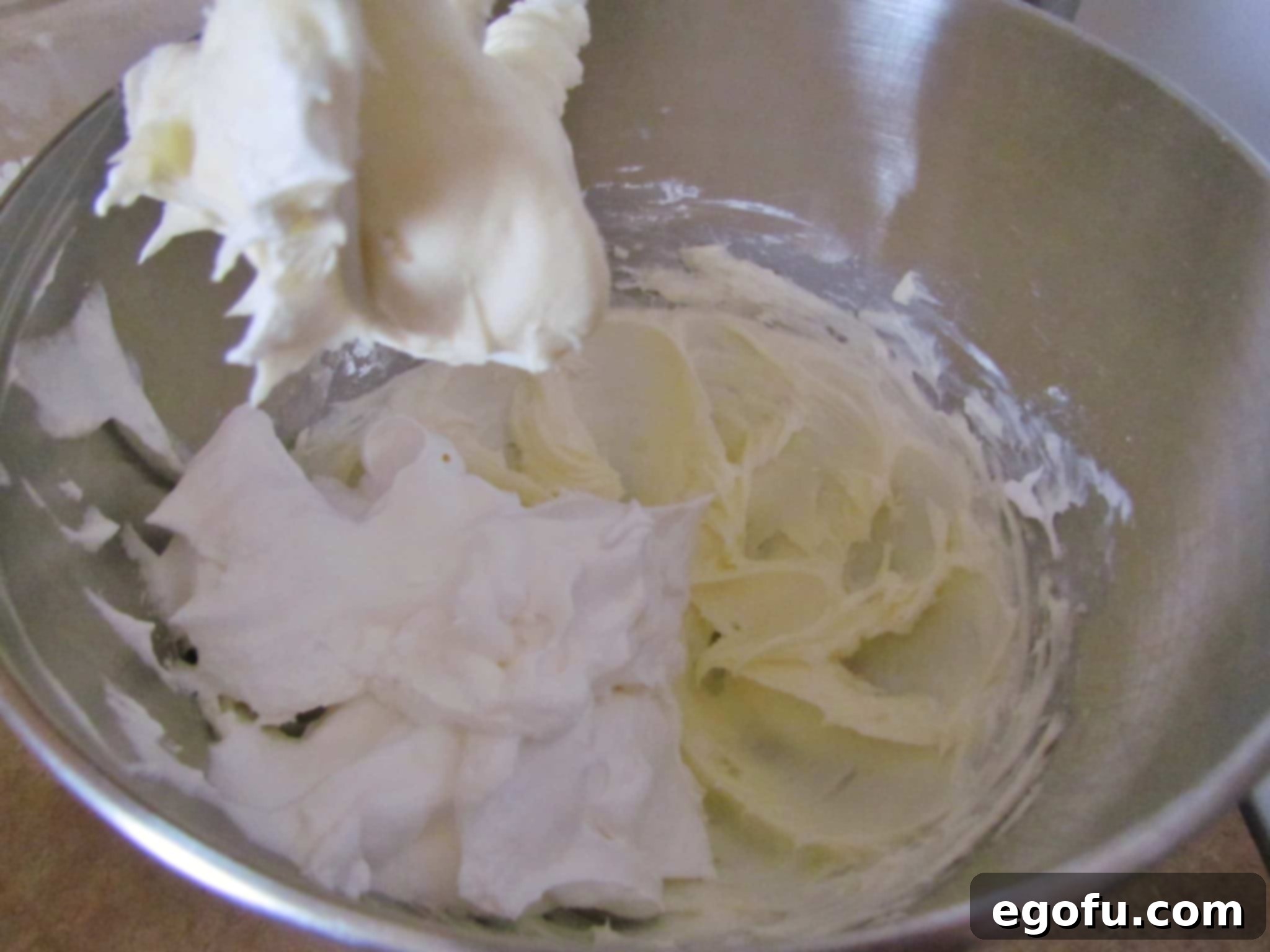 C Is For Cookie Layers 8 whipped topping mixed together with cream cheese and powdered sugar.