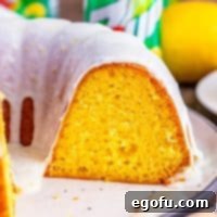 A close-up image of a delicious 7Up Cake, highlighting its moist texture and inviting lemon glaze.