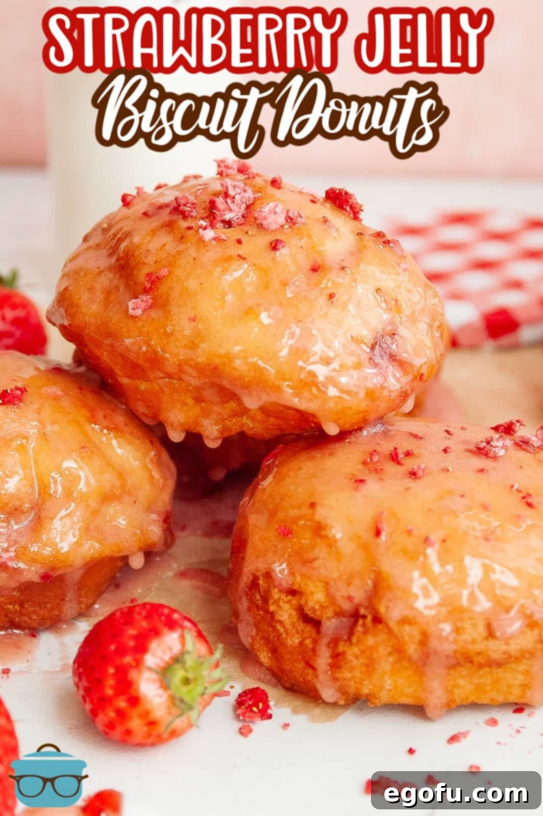Pinterest image of Strawberry Jelly Filled Biscuit Donuts on plate.