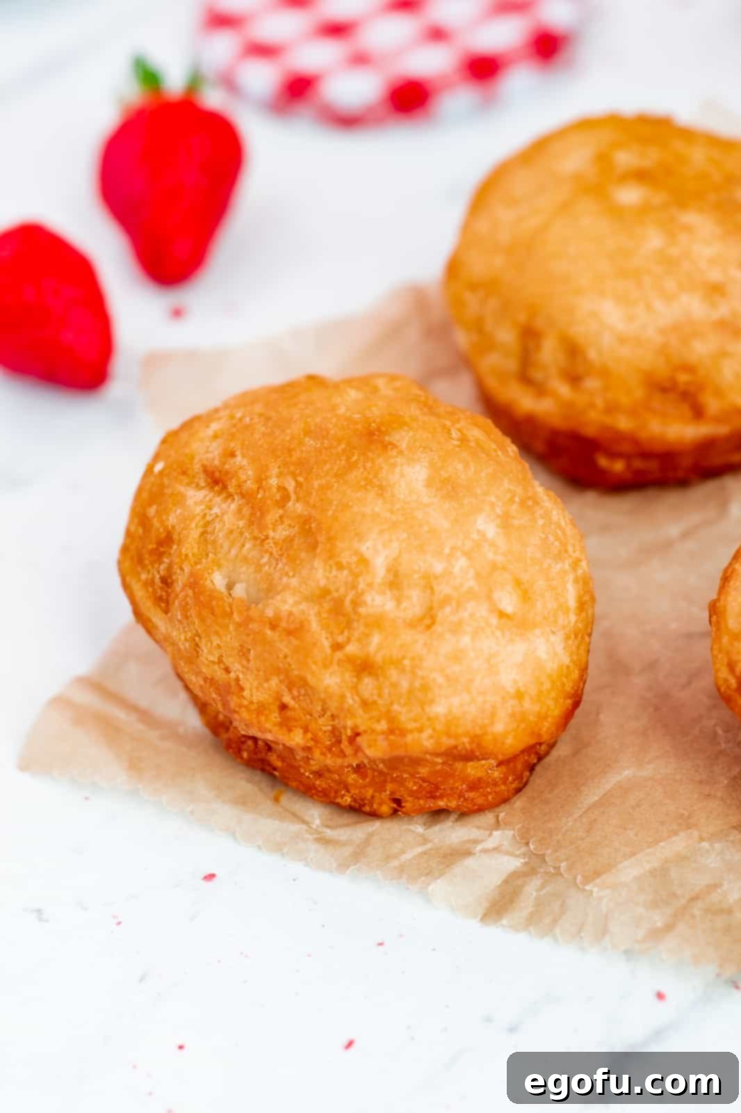 Finished fried donuts on towel.