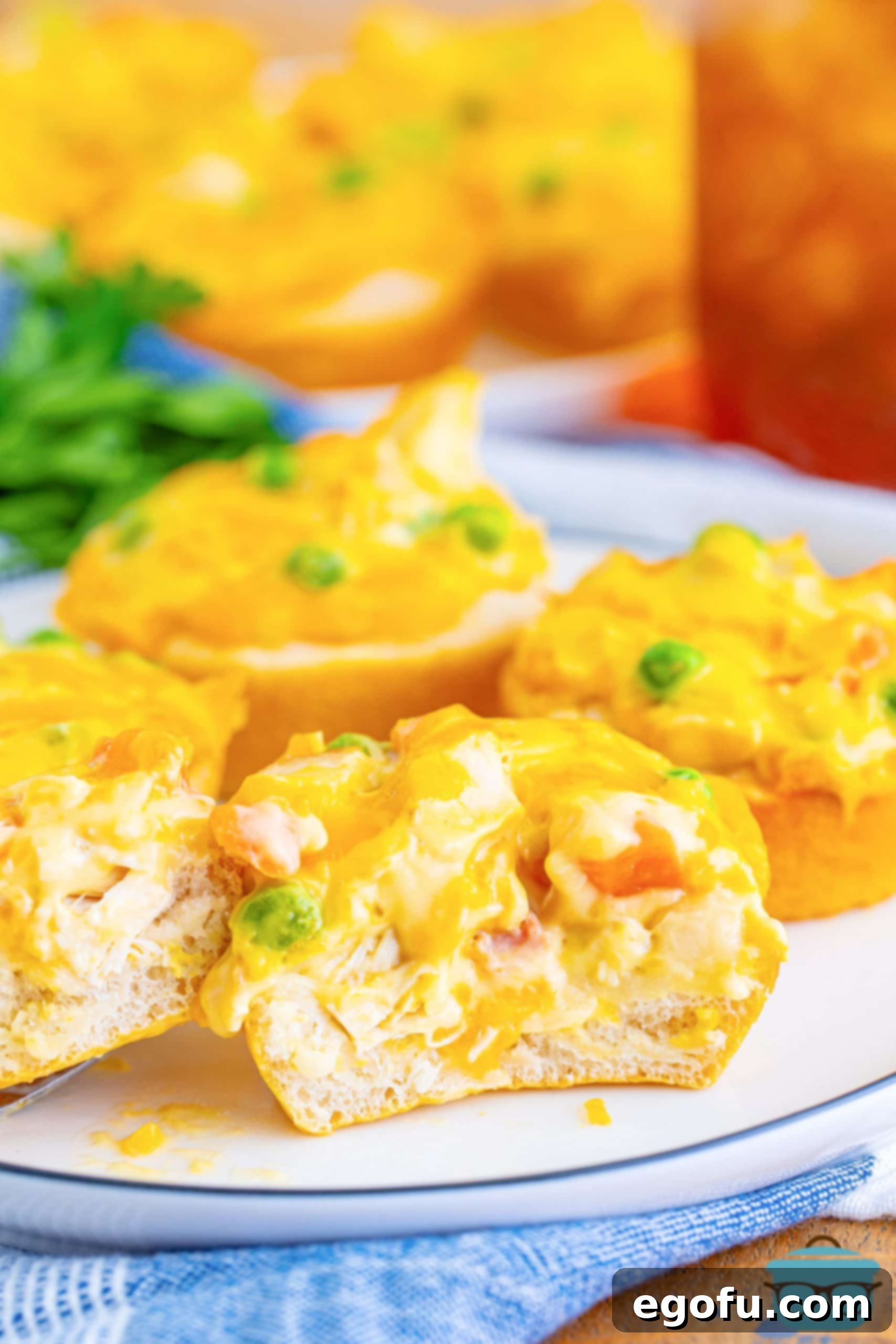 A few Mini Chicken Pot Pies on a plate, one cut in half.