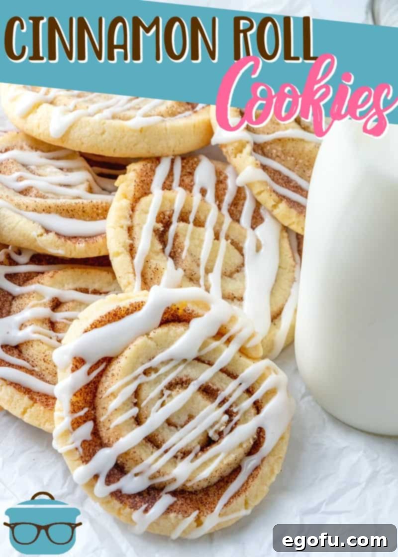 Easy Cinnamon Roll Cookies recipe. Cookies shown stacked on white parchment paper with a bottle of milk on the side.