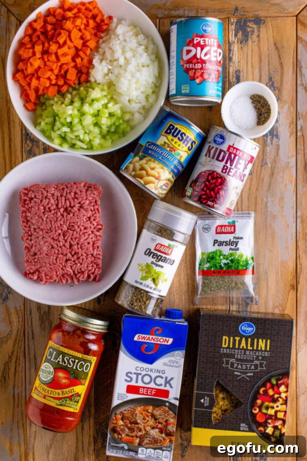 ground beef, onion, carrots, celery, diced tomatoes, dark red kidney beans, cannellini beans, spaghetti sauce, dried oregano, dried parsley, black pepper, ditalini pasta, salt.
