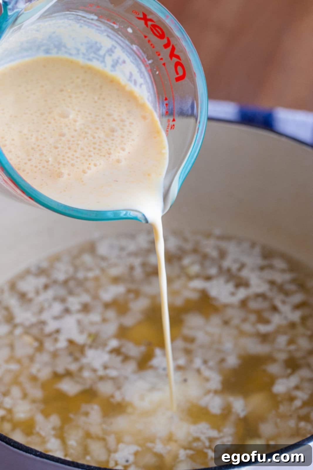 gravy mix mixed with milk then poured into dutch oven. 