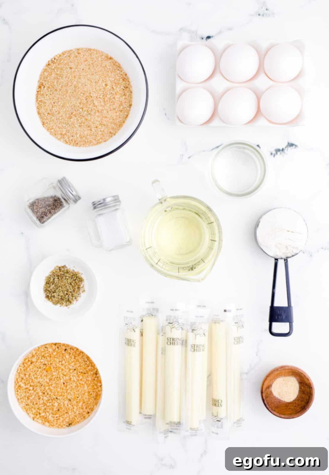 Ingredients needed: all-purpose flour, eggs, water, bread crumbs, panko breadcrumbs, italian seasoning, salt, garlic powder, pepper, mozzarella string cheeses and canola oil.