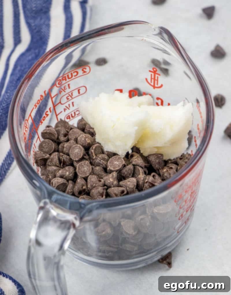 semi sweet chocolate chips and coconut oil in a microwave safe measuring cup.