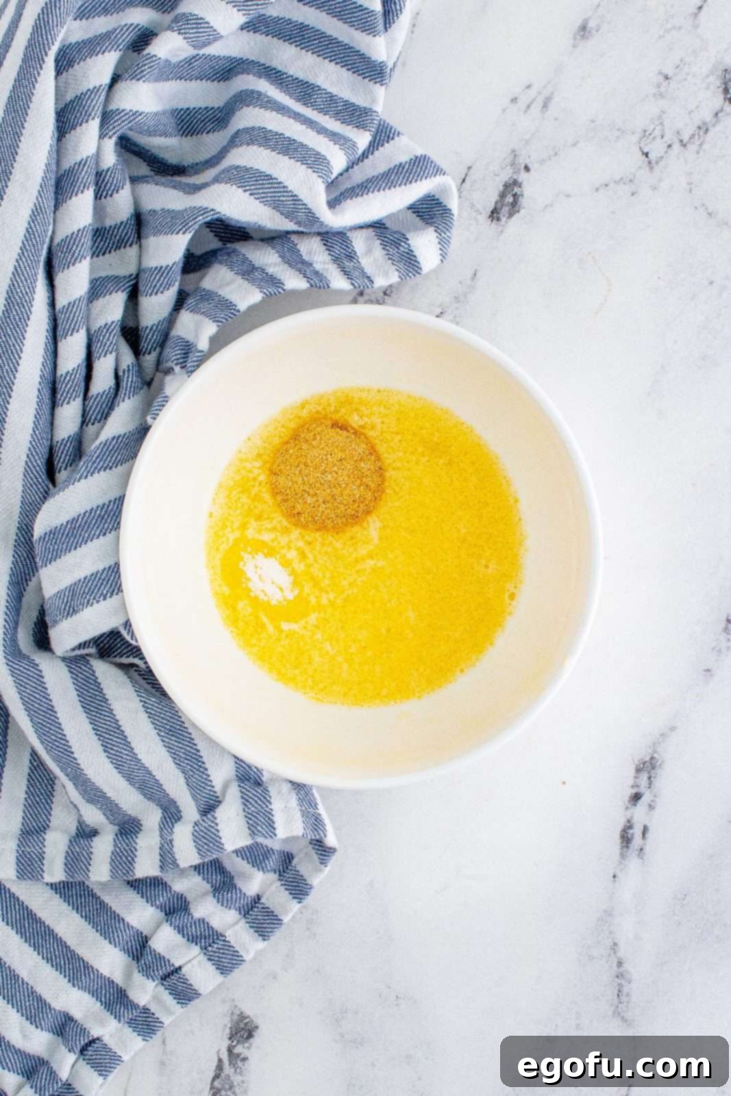 melted butter, salt and garlic powder in a bowl