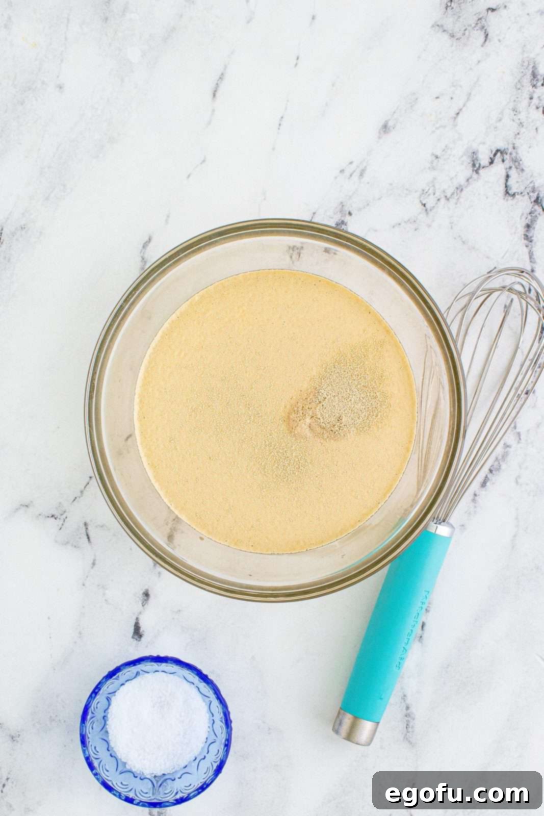 warm water, yeast and sugar in a small clear bowl.