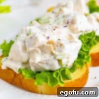 Close up looking at a sandwich with homemade Chicken Salad.