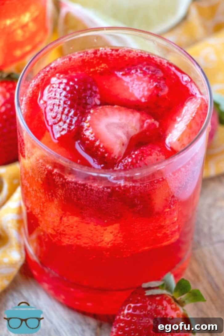 Effervescent Strawberry Bliss 2 Sparkling Strawberry Punch served in a glass.