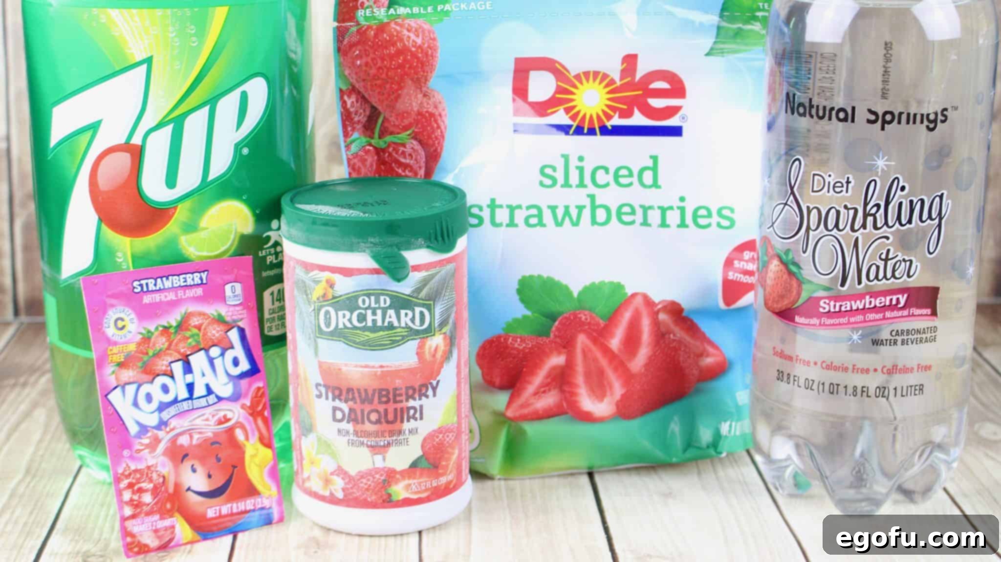 Effervescent Strawberry Bliss 4 frozen strawberry daiquiri concentrate, strawberry Kool-Aid, 7-Up lemon-lime soda, strawberry sparkling water, frozen sliced strawberries.
