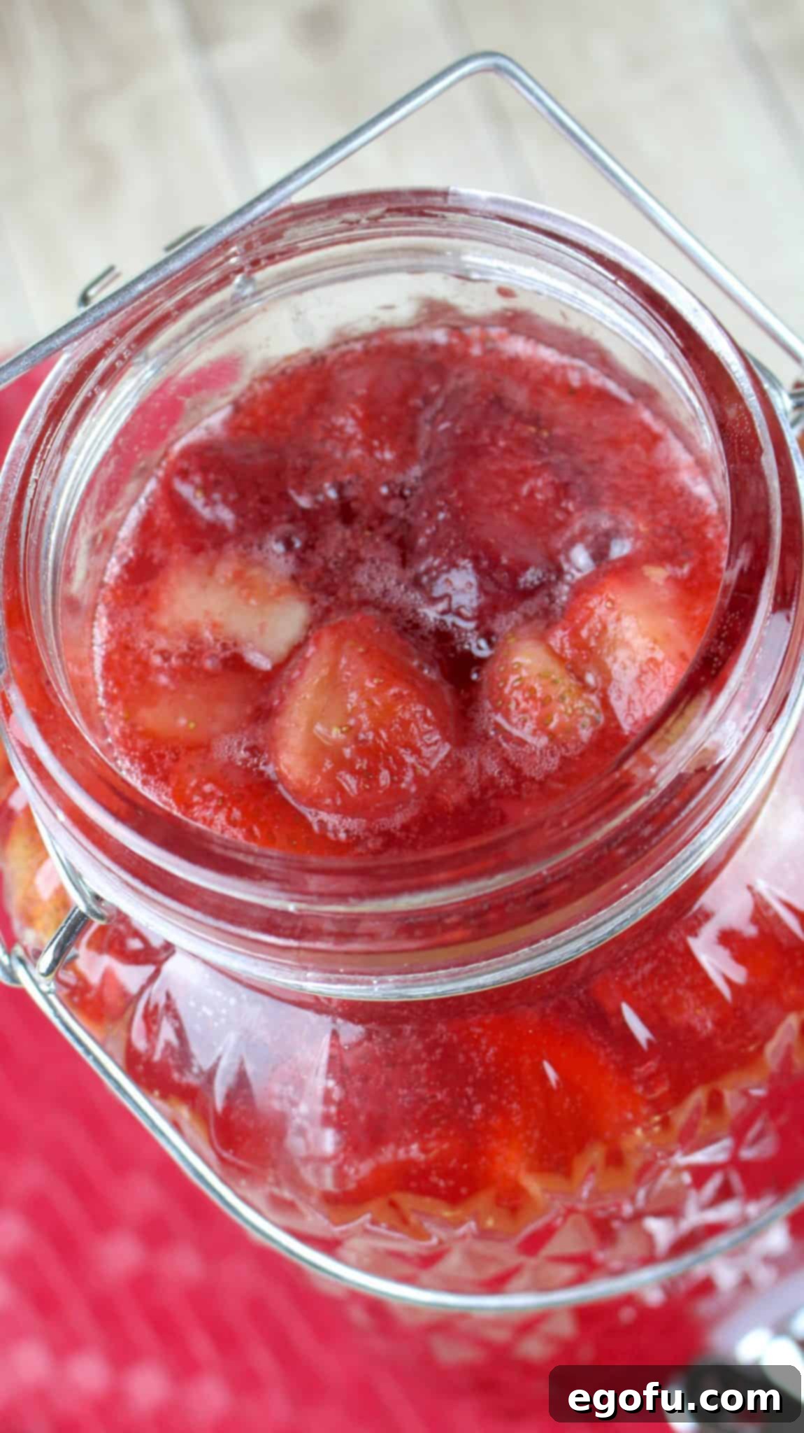 Effervescent Strawberry Bliss 7 frozen strawberries added to sparkling strawberry punch bowl.