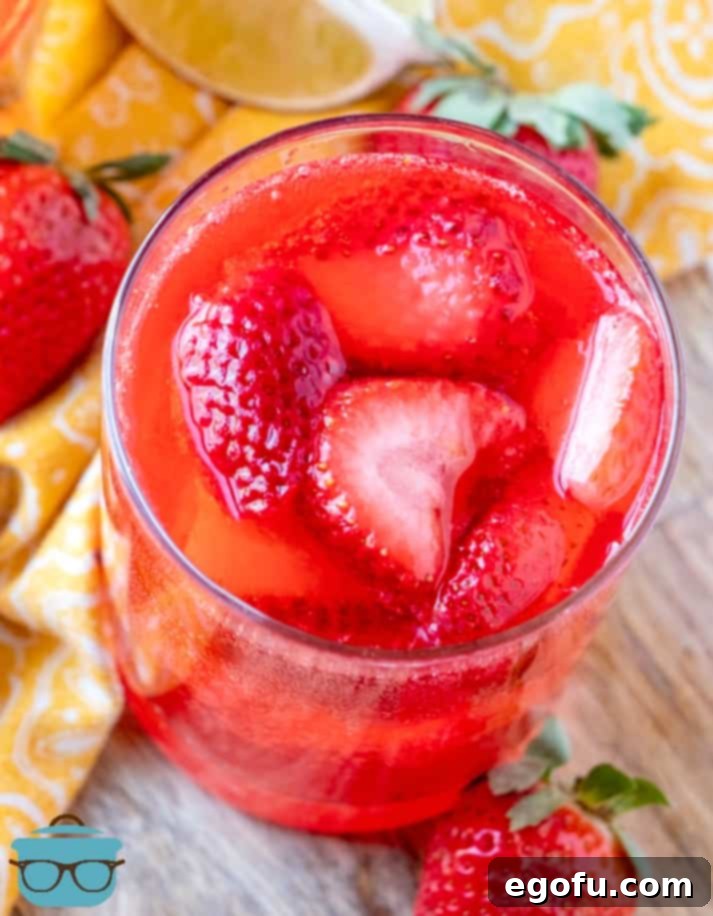 Effervescent Strawberry Bliss 8 Sparkling Strawberry Punch topped with fresh strawberries.