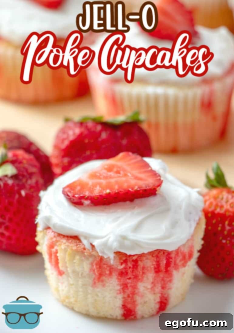 Strawberry Burst Poke Cupcakes 3 Beautifully frosted Strawberry Jell-O Poke Cupcakes, garnished with fresh strawberry slices, presented on a pristine white plate.