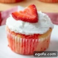 Strawberry Burst Poke Cupcakes 9 Strawberry Jell-O poke cupcakes