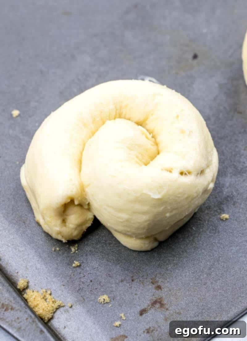 Effortless Cheesy Danishes 9 coiled crescent roll dough to make a danish shape.