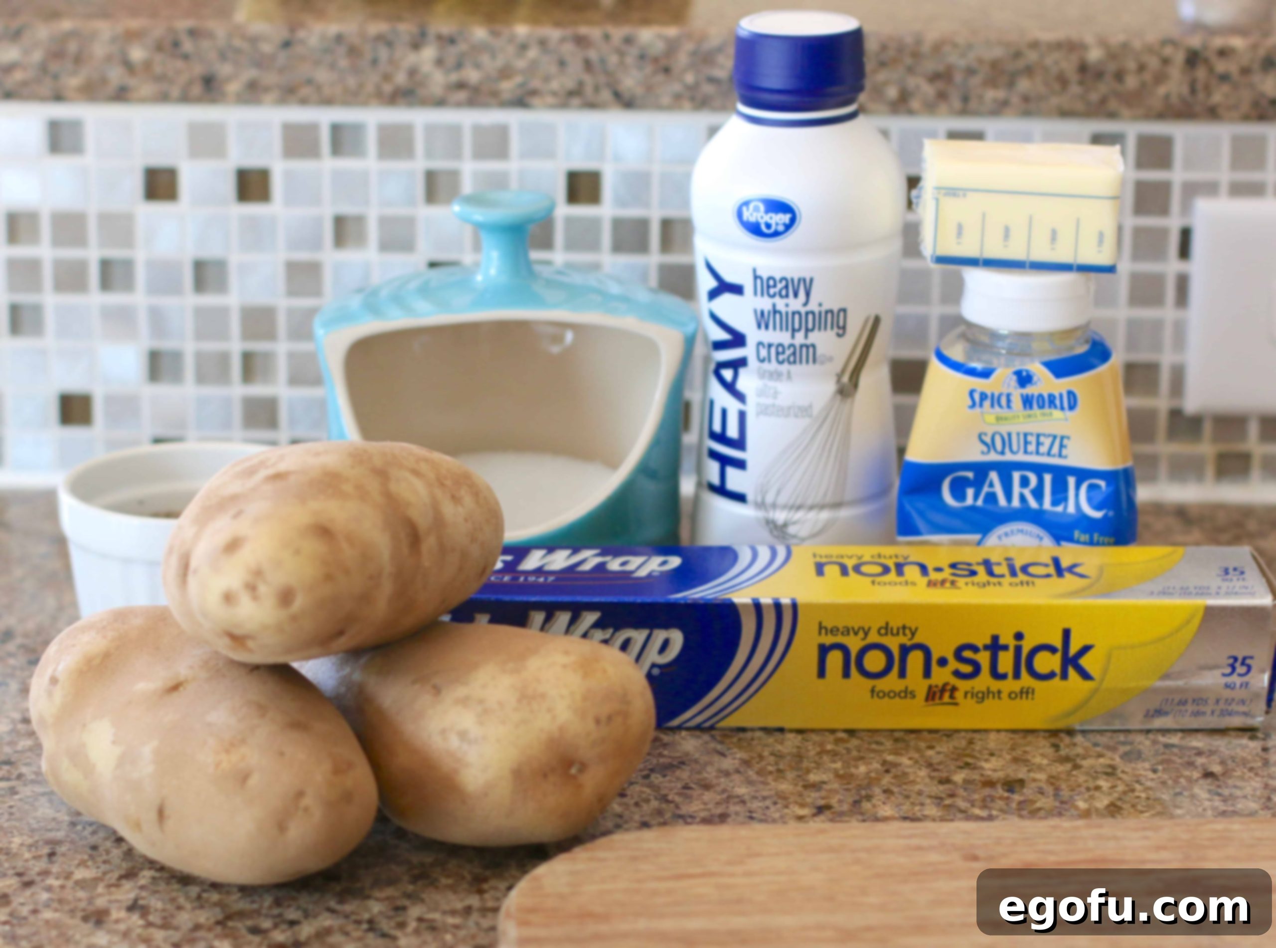 russet potatoes, heavy cream, butter, garlic, salt, aluminum foil.
