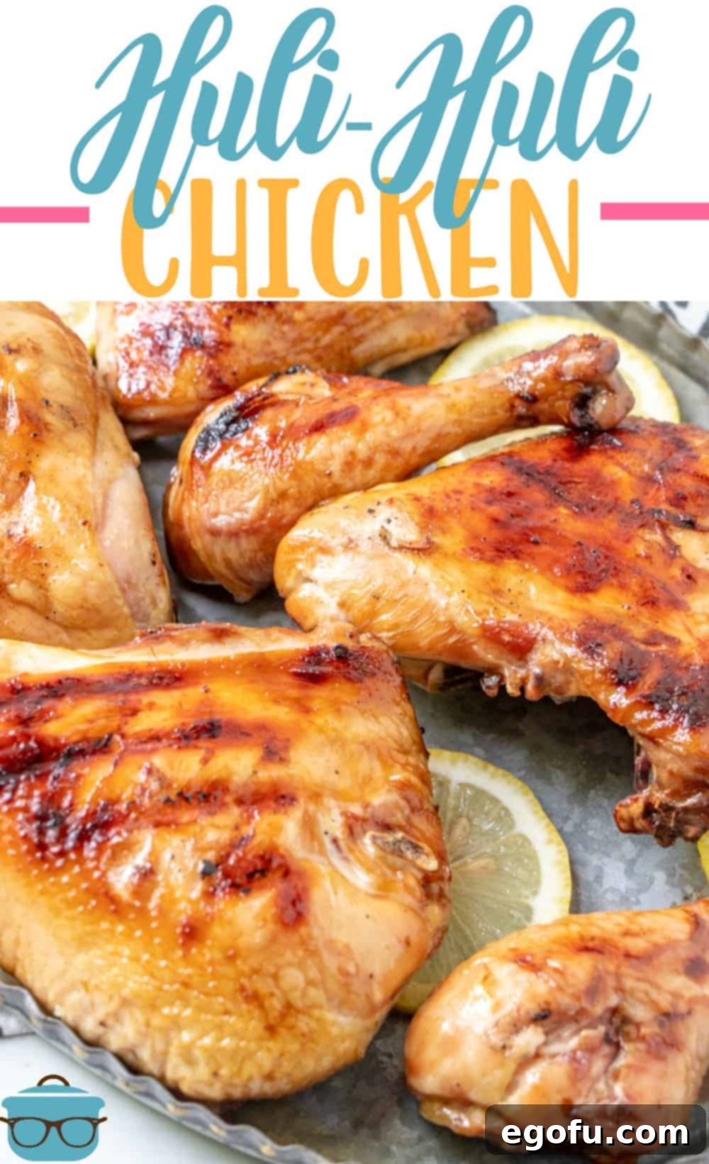 close up photo of grilled HULI HULI chicken on a metal platter.