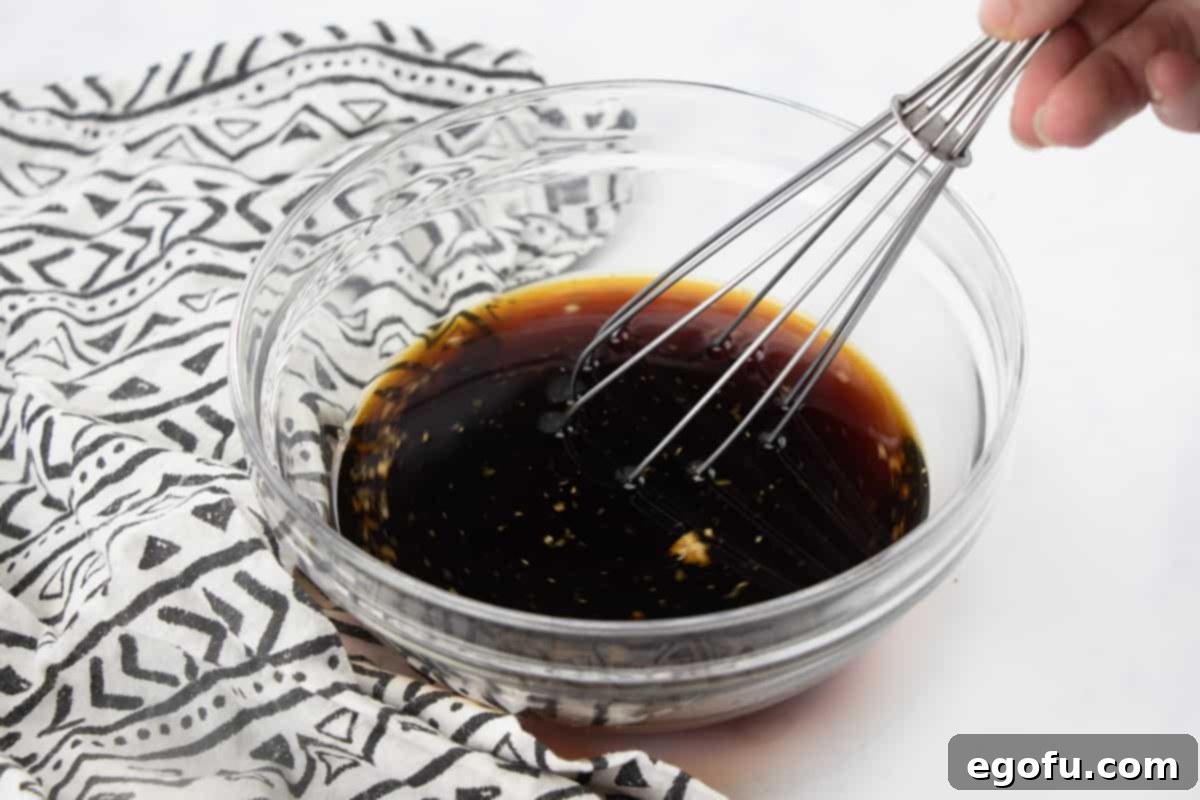 soy sauce, white wine (or chicken broth), sugar in the raw, freshly grated ginger, garlic whisked together in a bowl.