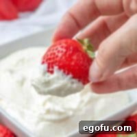 Easy, Creamy Fruit Dip, strawberry dipped into fruit dip