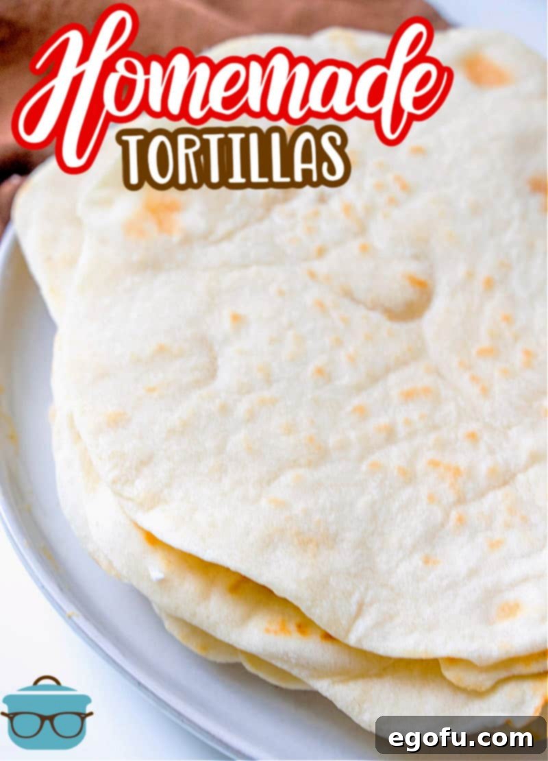 Soft Homemade Flour Tortillas 3 Homemade Flour Tortillas recipe from The Country Cook, flour tortillas shown stacked on a white plate, highlighting their delicate edges.