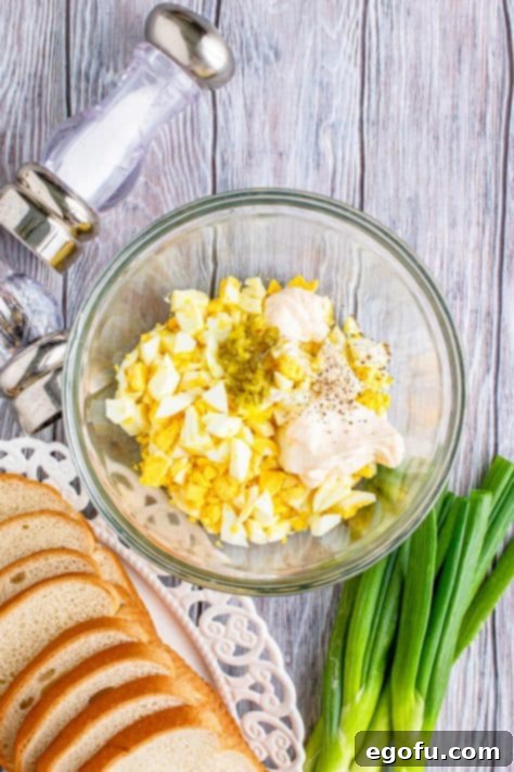 Irresistible Homemade Egg Salad 10 Egg salad ingredients in a bowl.
