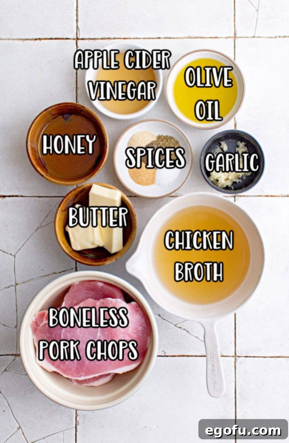 pork chops, apple cider vinegar, garlic, spices, olive oil and chicken broth.