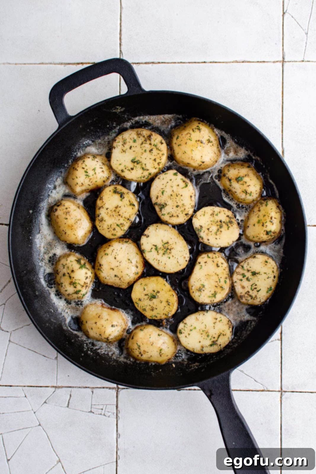 Golden Melt-Away Potatoes 4 Oil and butter melted with sliced potato added to pan.