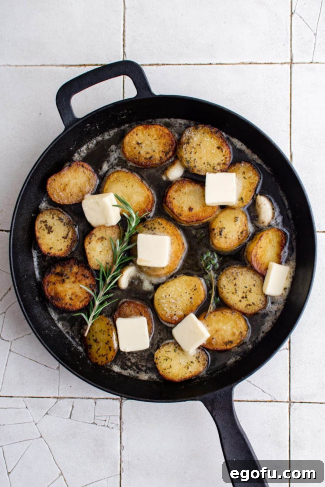 Golden Melt-Away Potatoes 6 Slices of butter added to top of potatoes in pan.
