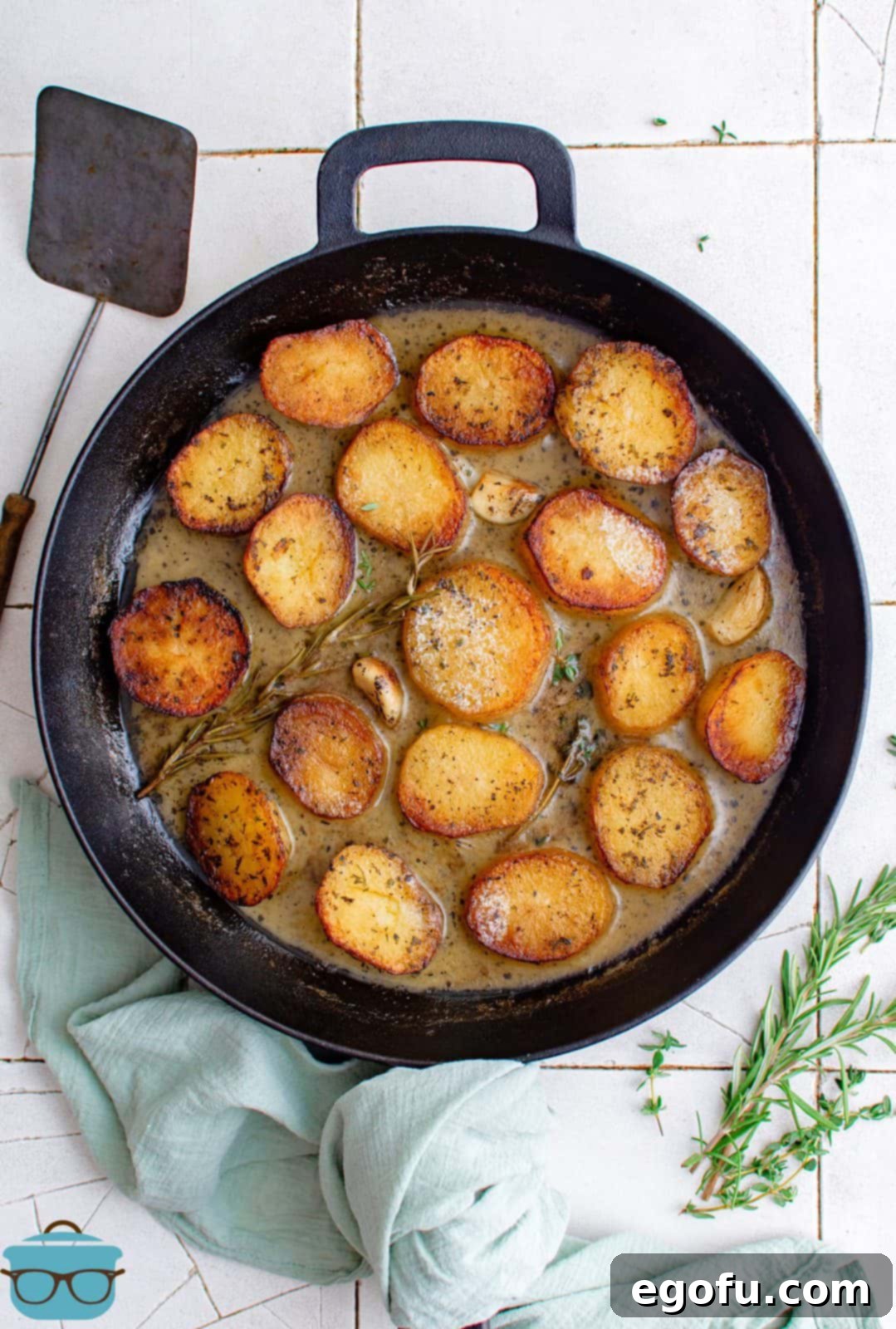 Golden Melt-Away Potatoes 7 Finished Melting Potatoes in skillet with butter sauce and fresh herbs.