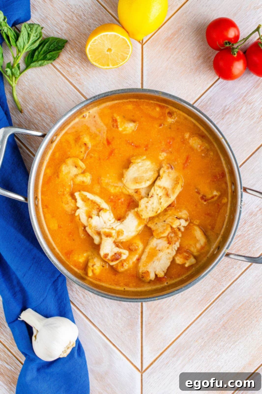 Lemon juice, chicken stock and chicken pieces added back to pan.