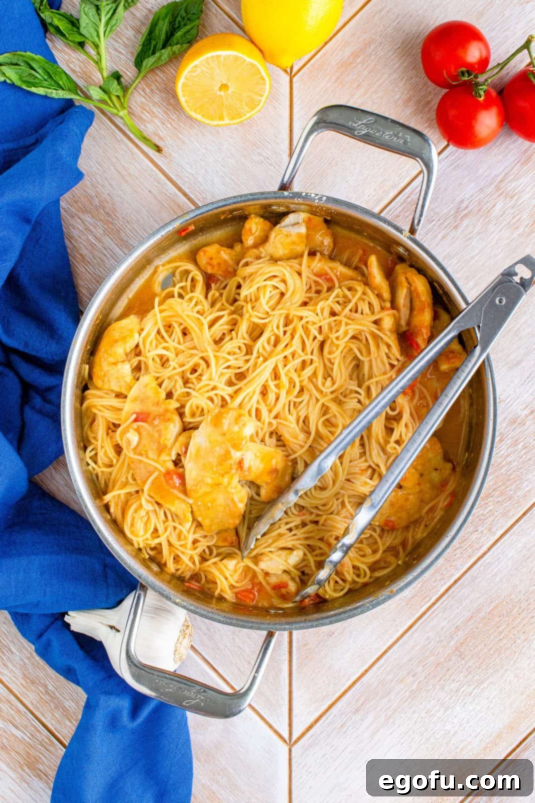 Pasta added to pan with sauce.