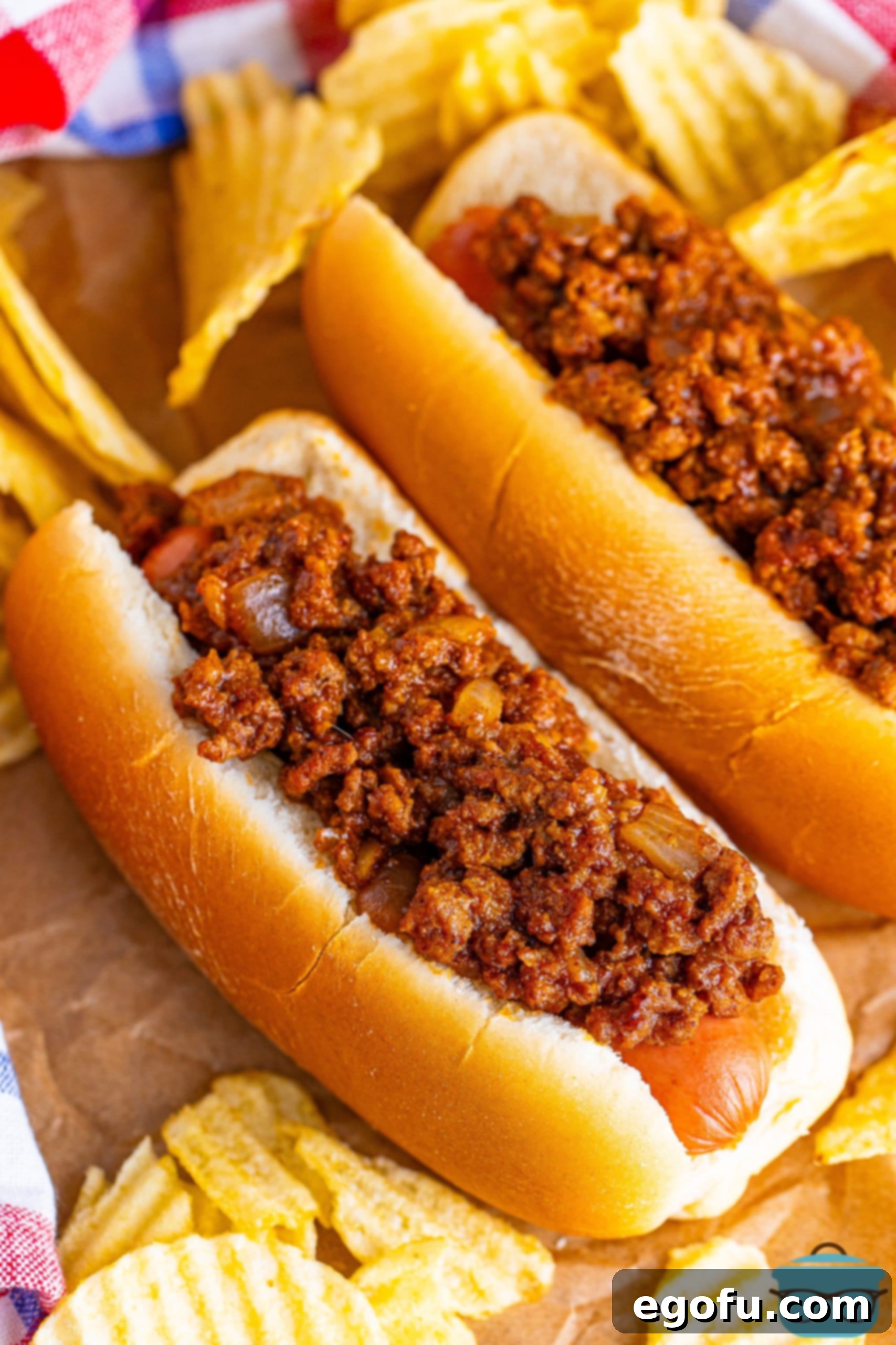 Looking down on two hot dogs with homemade Hot Dog Chili.