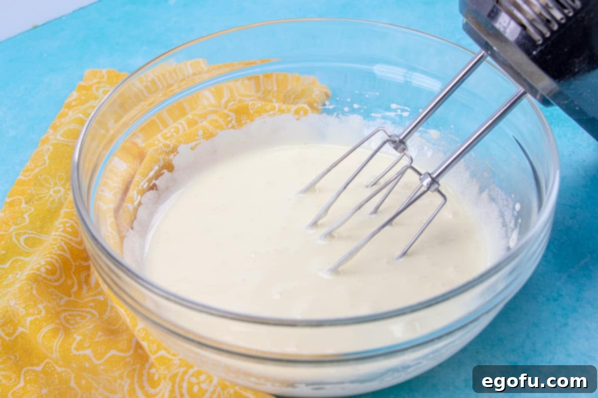 The Hot Milk Sponge Cake batter, smooth and ready to bake, after the hot milk and vanilla have been incorporated.