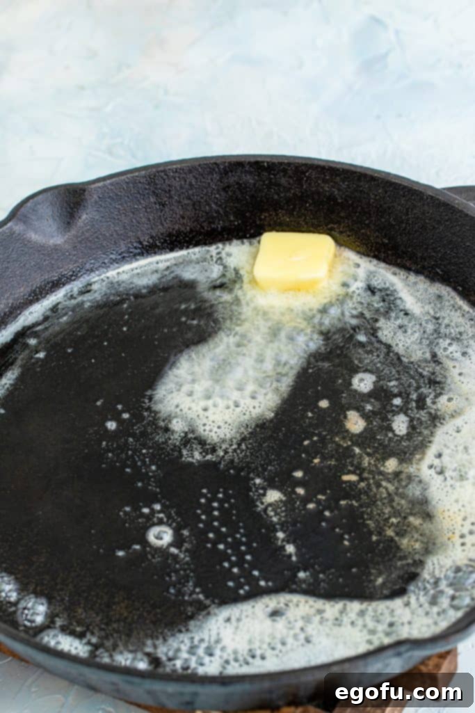 butter melted in a cast iron skillet.