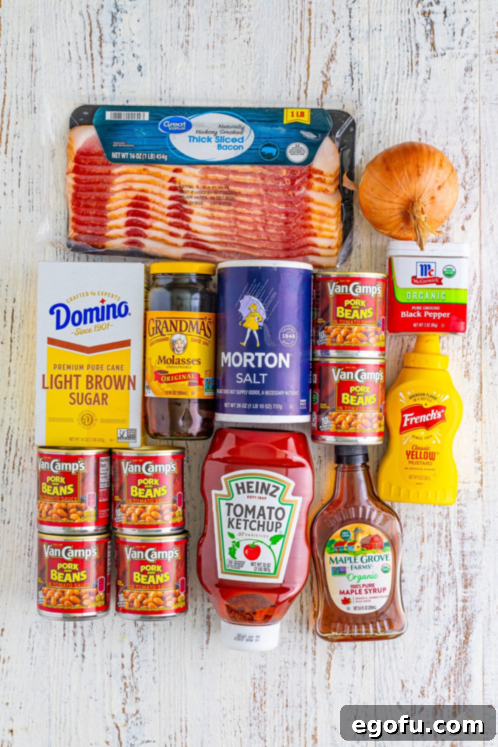 Hearty Comfort Baked Beans 4 Bacon, ketchup, molasses, mustard, onion, salt, pepper, pork and beans, brown sugar, and maple syrup.