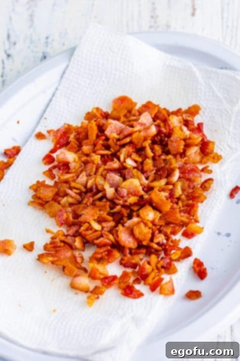 Hearty Comfort Baked Beans 10 Cooked and chopped bacon on paper towels.