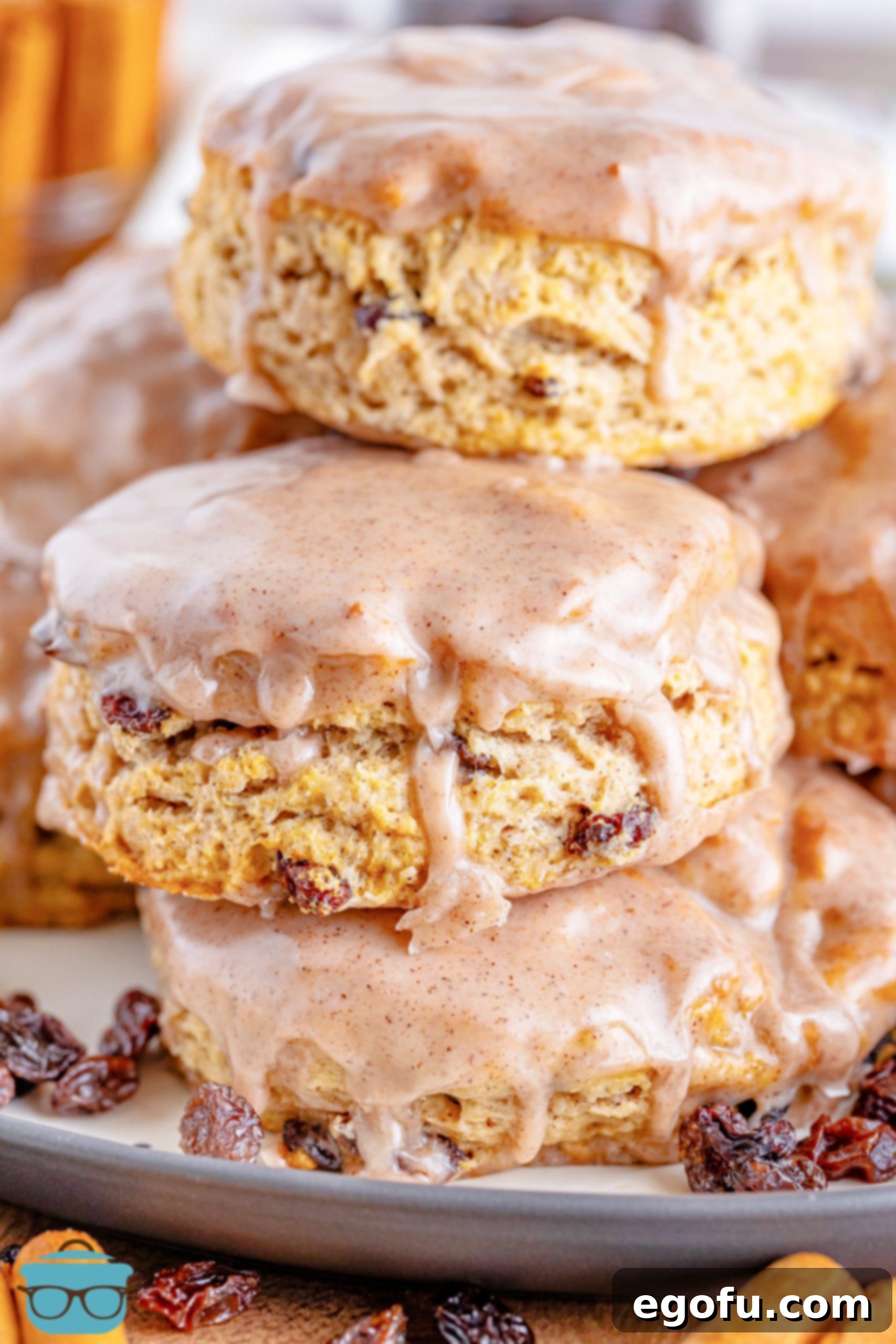 Buttery Cinnamon Raisin Biscuits 2 A small stack of homemade Cinnamon Raisin Biscuits with a glistening cinnamon glaze.