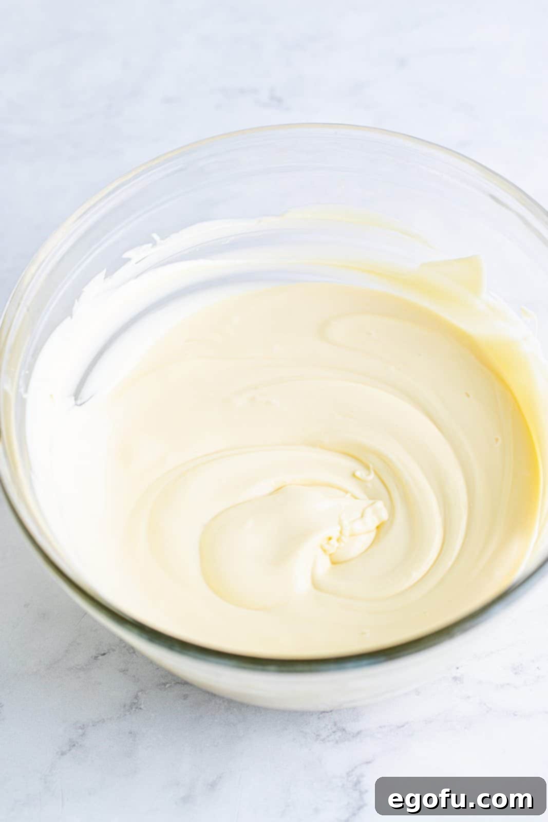 melted white chocolate in a clear bowl. 